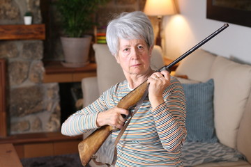 Senior woman holding a rifle