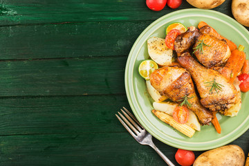 Grilled chicken leg with boiled potatoes and vegetable