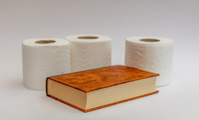 a book to read on the toilet with toilet paper around