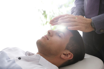 Psychotherapist and patient in office. Hypnotherapy session