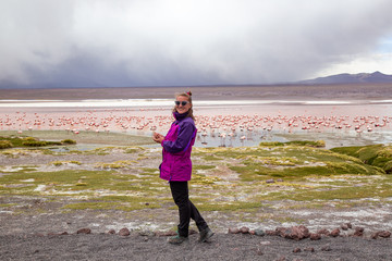 woman and flamingos