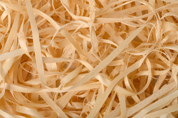 wood shavings background close-up, soft diffused light. Concept of environmentally friendly...