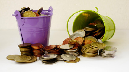 bucket with gold coin. concept save money coins in a bucket