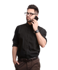 Fototapeta premium Young businessman talking on smartphone against white background