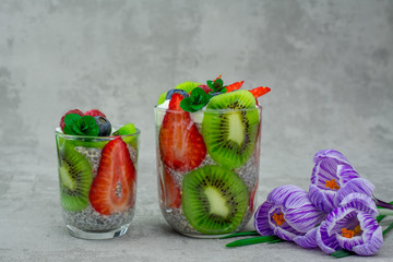 quinoa chia seeds dessert with almonds milk strawberry raspberry blueberry kiwi   fresh mint napkin 