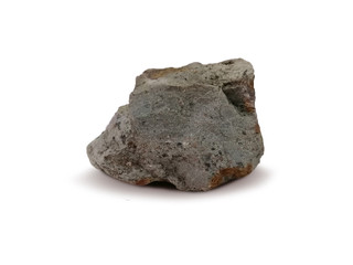 Tuff rock specimen on white background. Tuff is igneous rock that contains the debris from an explosive volcanic eruption.