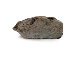 Obraz premium Tuff rock specimen on white background. Tuff is igneous rock that contains the debris from an explosive volcanic eruption.