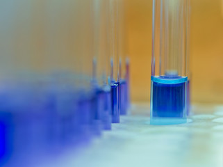 Tubes with blue liquid on test tube rack.