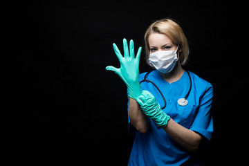 Portrait of doctor woman over black background.