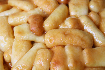 Chuck chuck - oriental flour sweets from dough and honey. Close-up. Background. Texture.