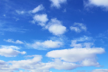 Beautiful blue sky and white cumulus and cirrus clouds. Background. Scenery.