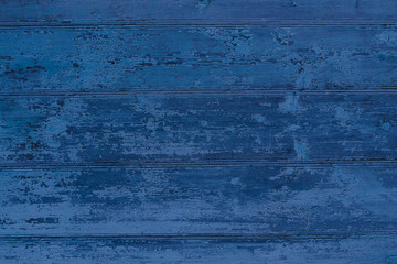 Fototapeta na wymiar Old wooden painted dark blue boards. Horizontal view. Background. Texture.
