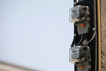 Electricity meter on the electricity post in the village , on 2020 March 14 , Bangkok Thailand