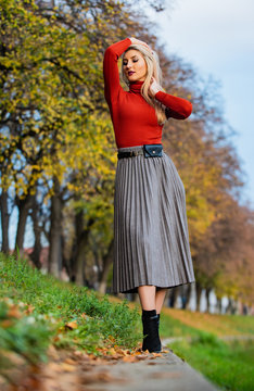 relax while walking. enjoy casual day. Clothing features pleats. must-have skirt. trendy girl wear corrugated skirt. pleated skirt collection. woman warm autumn skirt outdoor