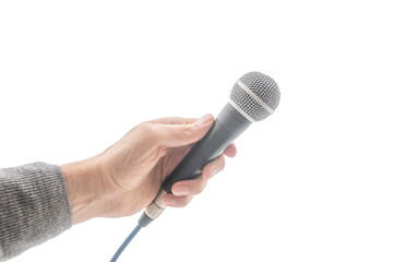 hand holds a microphone