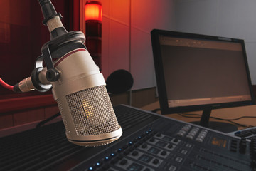 Professional microphone in radio station studio on air