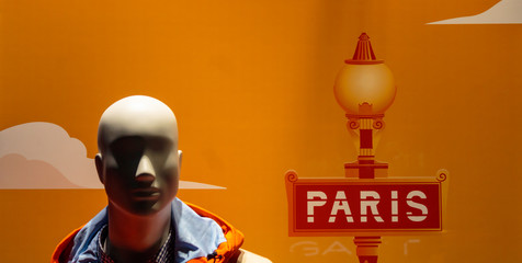 Paris sign next to shop dummy