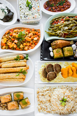Setting table (Bayram sofrasi) with traditional Turkish foods for Sugar Feast after Ramadan Eve or Feast of Sacrifices. 	
