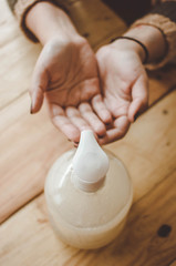 hands using antibacterial to clean virus