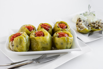Traditional Turkish dish,(biber dolma)fresh green pepper stuffed (rice)with olive oils.Holiday  dinner table.