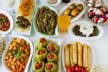 Setting table (Bayram sofrasi) with traditional Turkish foods for Sugar Feast after Ramadan Eve or Feast of Sacrifices. 	