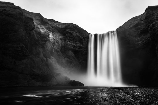 The Skógafoss iconic waterfall in Iceland in black and white