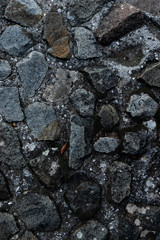 Texture of stone wall made of grey stones