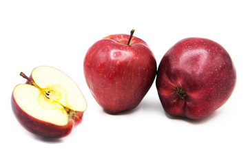 Fresh ripe organic apples and half apple isolated on white background.