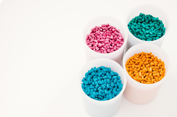 Plastic granules close up for holding,Colorful plastic granules with white background. and dollar...