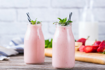 Pink smoothie with banana and strawberry for healthy, vegan diet
