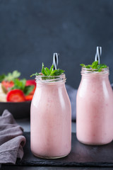Pink smoothie with banana and strawberry for healthy, vegan diet