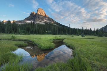 Liberty Bell Mountain reflected in waters of State Creek. in meadows of Washington Pass. North Cascades Washington. Washington. United States