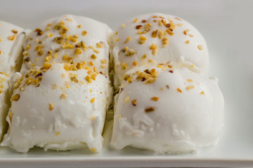 Traditional Turkish ice cream vanilla Maras,in the rectangular plate.More than a hundred and fifty years in Turkey.Elastic texture and you have to chew it. It is serv with a knife and a fork.