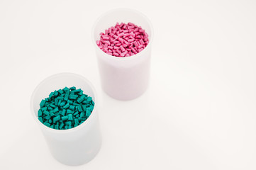 Plastic granules close up for holding,Colorful plastic granules with white background. and dollar money,Plastic Business,Plastic industry.