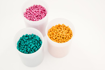 Plastic granules close up for holding,Colorful plastic granules with white background. and dollar money,Plastic Business,Plastic industry.