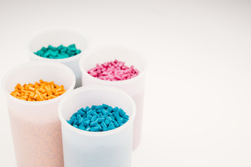 Plastic granules close up for holding,Colorful plastic granules with white background. and dollar money,Plastic Business,Plastic industry.