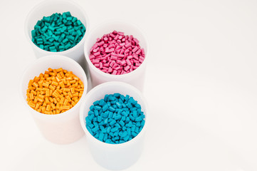Plastic granules close up for holding,Colorful plastic granules with white background. and dollar...