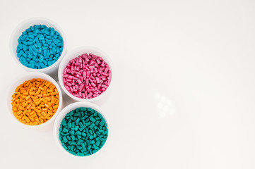 Plastic granules close up for holding,Colorful plastic granules with white background. and dollar...