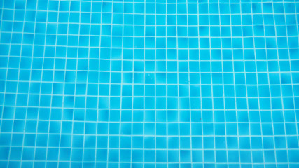 Closeup swimming pool with flow water wave and bottom surface texture and see top view using for...