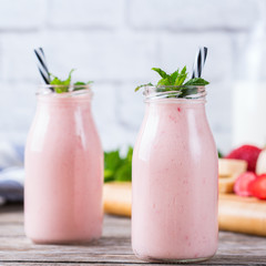 Pink smoothie with banana and strawberry for healthy, vegan diet