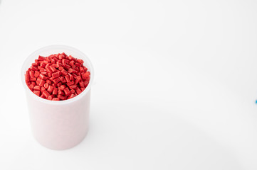 Plastic granules close up for holding,Colorful plastic granules with white background. and dollar money,Plastic Business,Plastic industry.