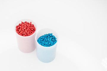 Plastic granules close up for holding,Colorful plastic granules with white background. and dollar money,Plastic Business,Plastic industry.
