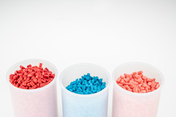 Plastic granules close up for holding,Colorful plastic granules with white background. and dollar money,Plastic Business,Plastic industry.