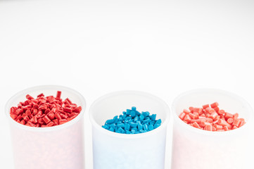 Plastic granules close up for holding,Colorful plastic granules with white background. and dollar money,Plastic Business,Plastic industry.