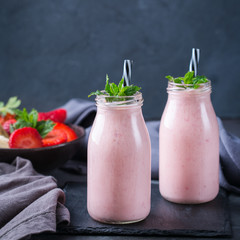 Pink smoothie with banana and strawberry for healthy, vegan diet