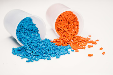 Plastic granules close up for holding,Colorful plastic granules with white background. and dollar...