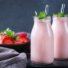 Pink smoothie with banana and strawberry for healthy, vegan diet