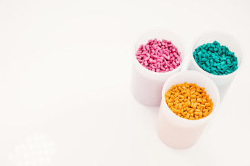Plastic granules close up for holding,Colorful plastic granules with white background. and dollar money,Plastic Business,Plastic industry.