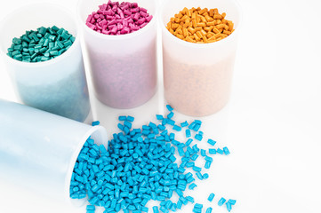 Plastic granules close up for holding,Colorful plastic granules with white background. and dollar money,Plastic Business,Plastic industry.