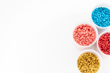 Plastic granules close up for holding,Colorful plastic granules with white background. and dollar...